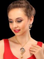 Portrait of a young woman in a red dress, with jewelry and makeup, looking downward to the left.