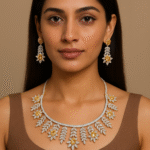 Portrait of a woman facing the camera, wearing a sparkling floral diamond-yellow jewelry set (necklace and matching earrings).
