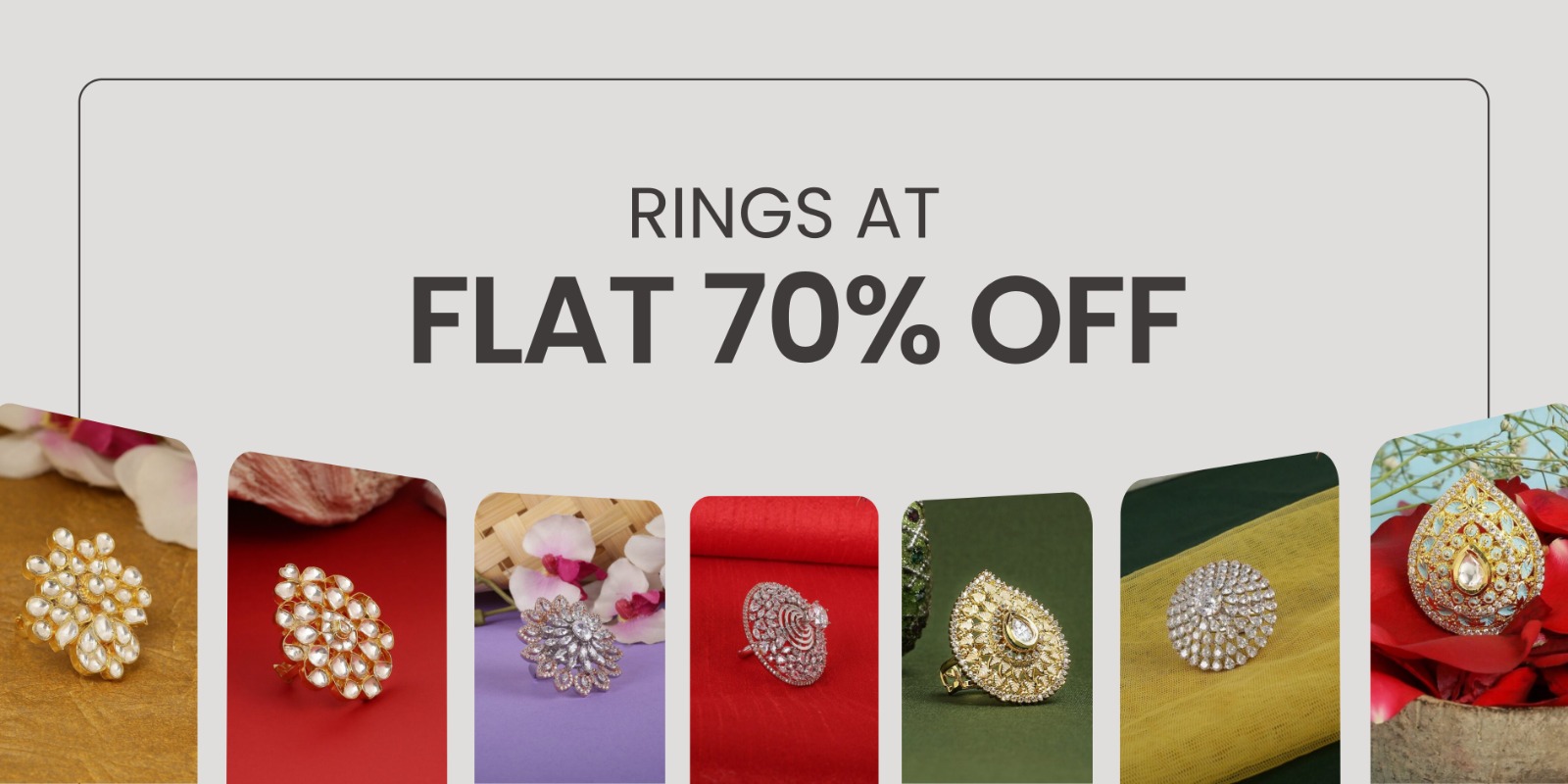 Sale banner advertising rings at flat 70% off with seven jeweled rings displayed along the bottom edge.